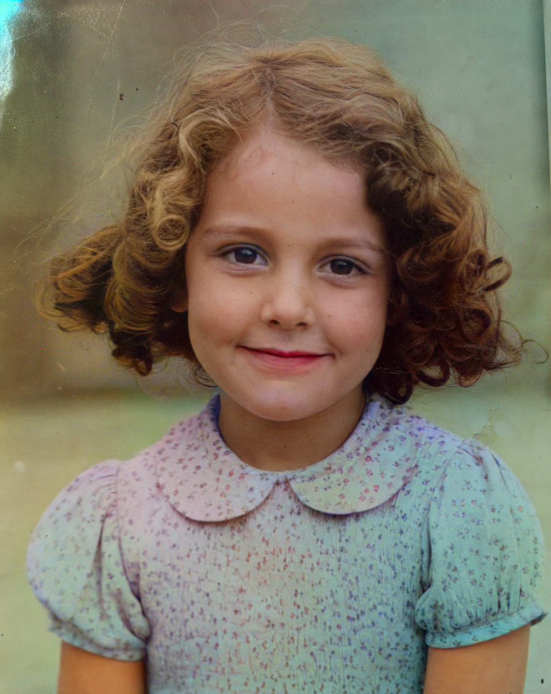 Childhood portrait with improved clarity after AI restoration
